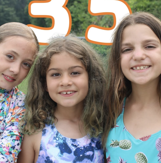 Campers smiling together outdoors